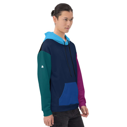 Model wearing Unisex-Kapuzenpullover N°43 with vibrant color blocking, featuring a soft brushed fleece interior.