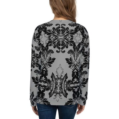 Person wearing Unisex-Pullover N°28 with intricate black print on gray fabric, showcasing unique all-over design for style and comfort.