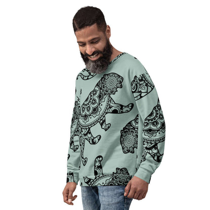 Man wearing Unisex-Pullover N°18 with intricate black design on mint fabric, showcasing stylish and unique fashion.