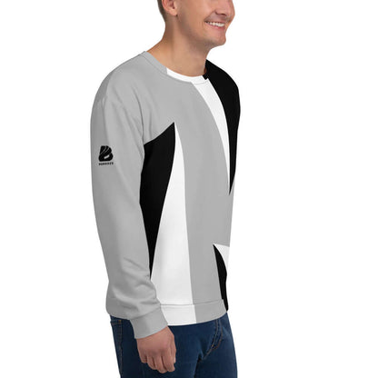 Unisex-Pullover N°2 featuring black, white, and gray geometric design with a comfortable cotton feel, worn by a smiling person.