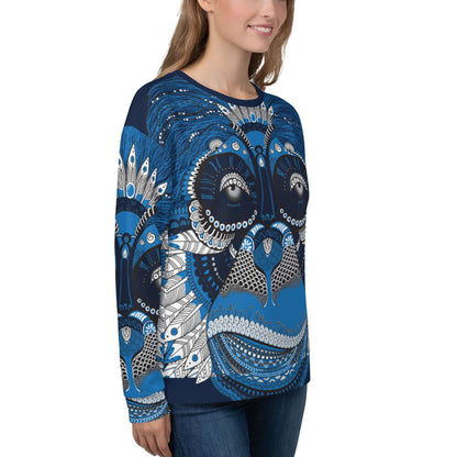 Unisex-Pullover N°4 with intricate blue and white design, featuring soft cotton-feel fabric, worn by a smiling person.