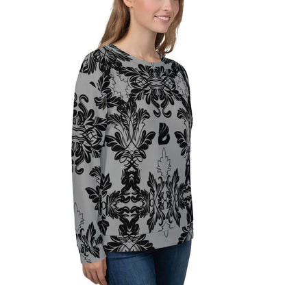 Model wearing Unisex-Pullover N°28 with intricate black and gray floral pattern.
