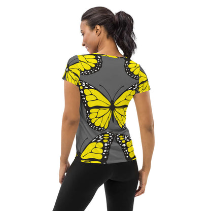 Woman wearing Allover-Sport-T-Shirt für Damen N°3 with butterfly design, showing back view