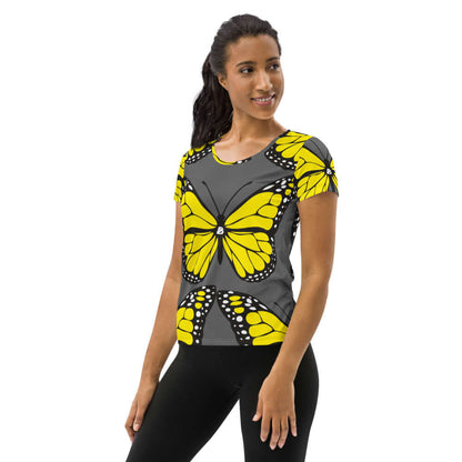 Woman wearing Allover-Sport-T-Shirt für Damen N°3 with yellow butterfly design