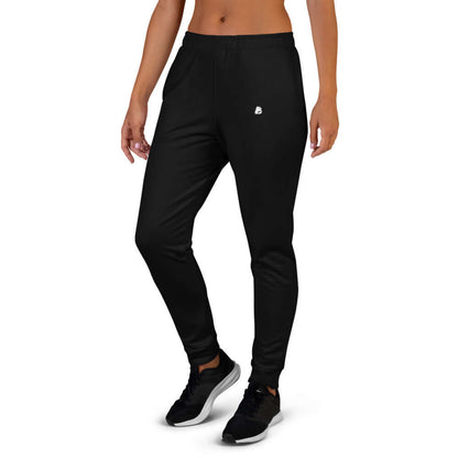 Frau trägt Damen-Jogginghose N°1 aus Baumwollmischung mit farbenfrohem Druck, eng anliegend und bequem für sportliche Aktivitäten.