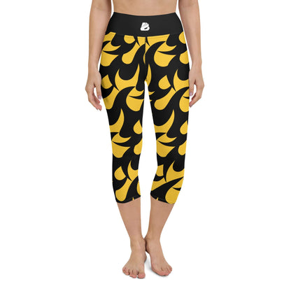 Person wearing Yoga-Capri-Leggings N°2 with yellow and black pattern, high waistband, 4-way stretch, ideal for yoga and gym activities.