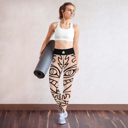 Woman in stylish Yoga-Leggings N°10 holding a yoga mat, featuring super soft, stretchy fabric with abstract pattern and high waistband.