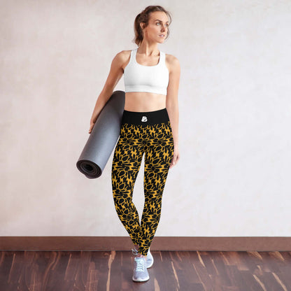 Woman wearing Yoga-Leggings N°22 with floral pattern, holding a yoga mat, showcasing comfort and style.