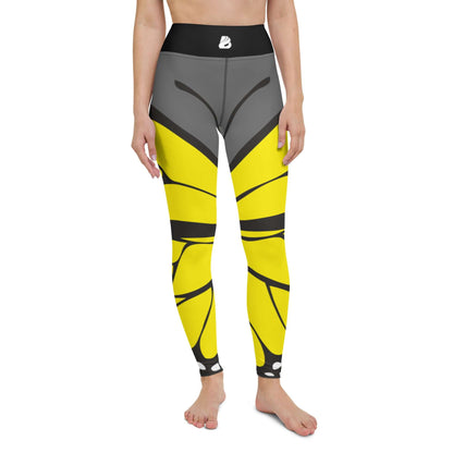 Woman wearing Yoga-Leggings N°41 with yellow butterfly design, featuring high waist and four-way stretch for comfort and flexibility.