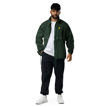 Man wearing Basic-Unisex-Windbreaker N°0 in green, showcasing lightweight and durable material ideal for camping and everyday errands.
