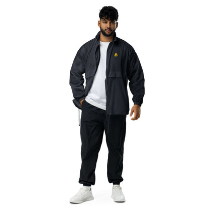 Basic-Unisex-Windbreaker N°0 in black, worn by model. Durable and water-resistant with zip and elastic cuffs for outdoor activities.