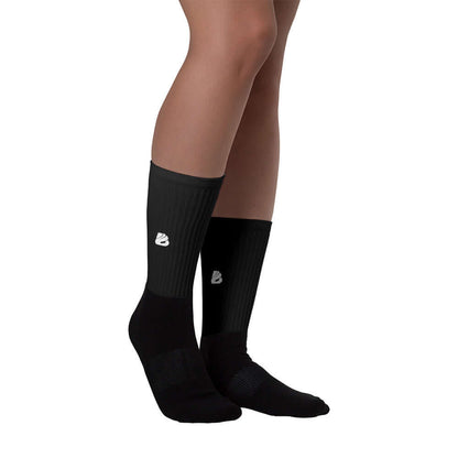 Socken N°2 worn by model, featuring padded soles and vibrant colors on black foot.