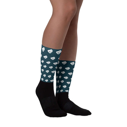 Person wearing Socken N°4 with cushioned soles and ribbed legs, featuring vibrant, fade-resistant print.