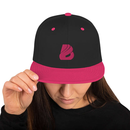 Snapback-Cap N°3 with pink and black design, featuring a structured six-panel high-profile and an adjustable snap closure.