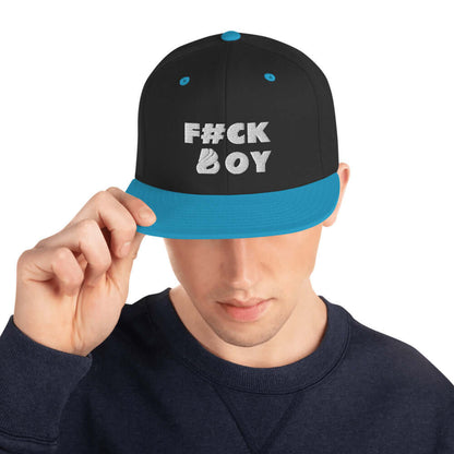 Person wearing Snapback-Cap N°2 with unique text design, featuring classic fit, flat brim, and blue accents.
