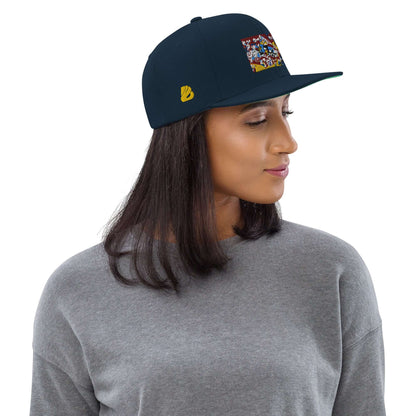 Woman wearing Snapback-Cap N°4 with classic fit and flat brim, featuring a grey sweater and artistic design on navy cap.