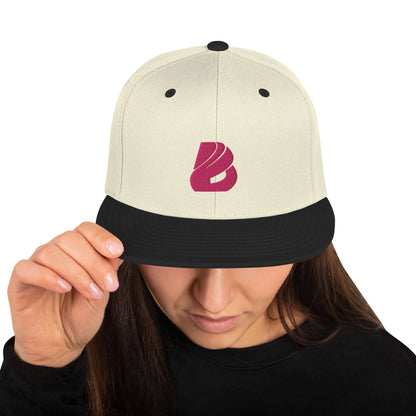 Woman wearing Snapback-Cap N°3 with classic fit, flat visor, and adjustable snap closure.