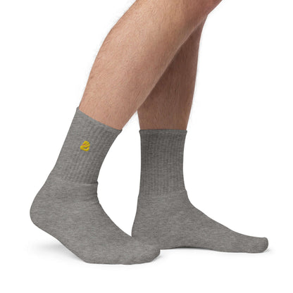 Gray Bestickte Socken N°0 worn by a person, showcasing embroidery detail and premium quality. USA-made socks with a padded sole and logo watermark.