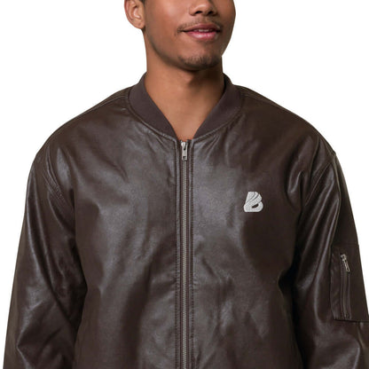 Person wearing Leder-Bomberjacke N°0 in brown PU leather with ribbed cuffs and embroidery, styled for casual or sporty looks.
