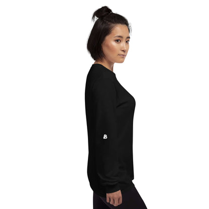 Side view of a person wearing the Unisex-Langarmshirt N°0 in black with ribbed cuffs, perfect for cooler days.