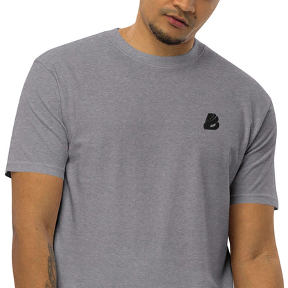 Man wearing Schweres Premium T-Shirt für Herren N°0 in grey with logo, featuring a stylish fit, made from ring-spun cotton for comfort.