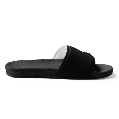 Side view of Herren-Schlappen N°1 black sandal with cushioned strap and textured footbed for summer comfort.