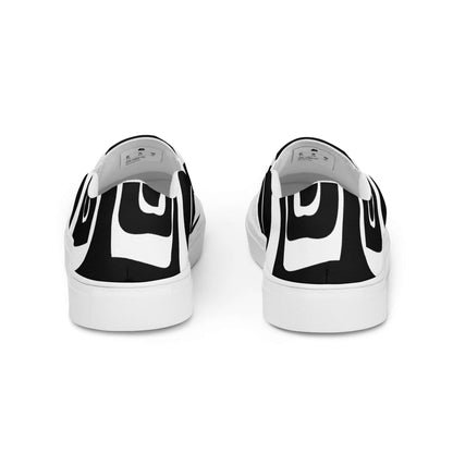 Back view of Herren-Canvas-Slipper N°0 with black and white design, featuring removable soft insoles and EVA rubber soles for comfort.