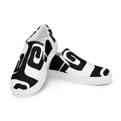 Stylish Herren-Canvas-Slipper N°0 with bold black and white design, lightweight comfort, EVA rubber sole, and removable insoles.