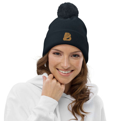 Woman wearing Bommel-Beanie N°0 in autumn, 100% soft acrylic, black with pom pom.