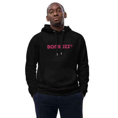 Person wearing black hoodie with "BON BOIZ" text, hands in pockets, showing front design for fashion item display.