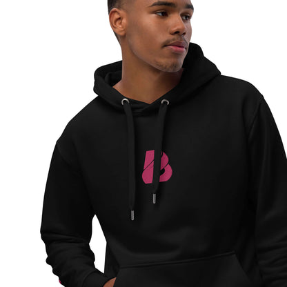 Model wearing black Hochwertiger Öko Kapuzenpullover N°8 with front pocket and double-layer hood, made from bio and recycled materials.