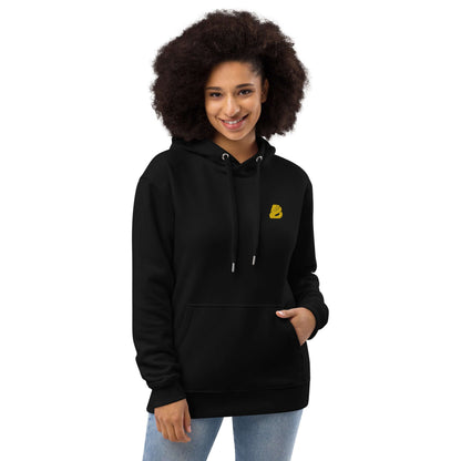 Model wearing Hochwertiger Öko Kapuzenpullover N°5 in black with front pocket and double-layered hood, crafted from organic and recycled materials.