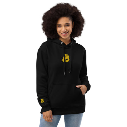 Woman wearing Hochwertiger Öko Kapuzenpullover N°9 in black with front pocket and double-layered hood, showcasing eco-friendly fashion.