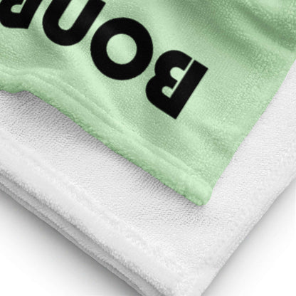 Close-up of Handtuch N°0 with vibrant colors, super soft fabric, and terry backing for water absorption.