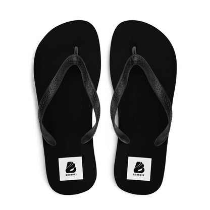 Black Flip-Flops N°8 with soft fabric-covered rubber soles and Y-shaped straps, perfect for summer adventures.