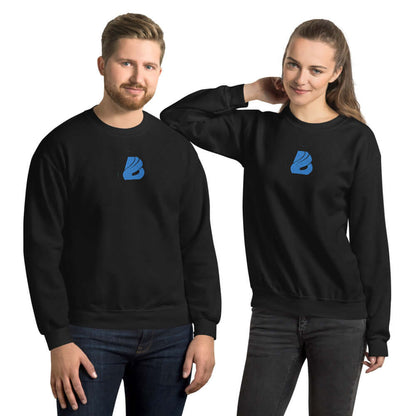 Unisex-Pullover N°26 in black, featuring a soft, preshrunk blend of cotton and polyester, worn by a man and woman for warmth and durability.
