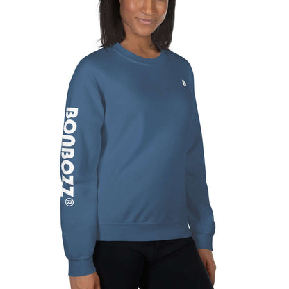 Model wearing Unisex-Pullover N°13 in blue, featuring BONBOZZ branding on sleeve, ideal for warmth during cold months. 50% cotton, 50% polyester.