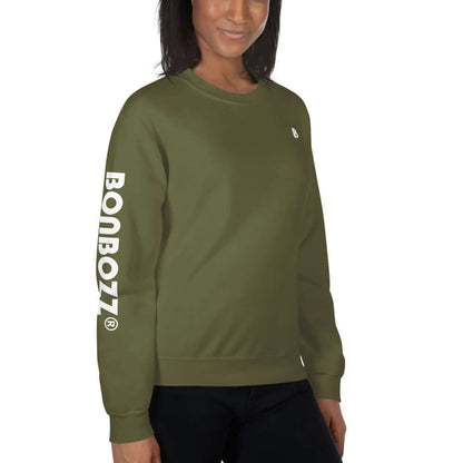 Model wearing Unisex-Pullover N°13, a green pullover with BONBOZZ logo on the sleeve, made from 50% cotton, 50% polyester.