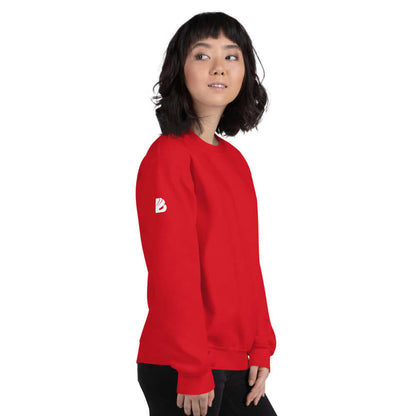 Model wearing red Unisex-Pullover N°5 with logo on the sleeve, showcasing its classic fit and sporty ribbed trims.