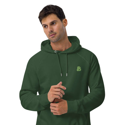 Man wearing green Unisex Bio-Raglan-Hoodie N°0 for casual and stylish look, showcasing soft fabric and comfortable design.