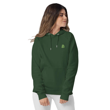 Model wearing Unisex Bio-Raglan-Hoodie N°0 in green, showcasing its comfortable fit and stylish design.