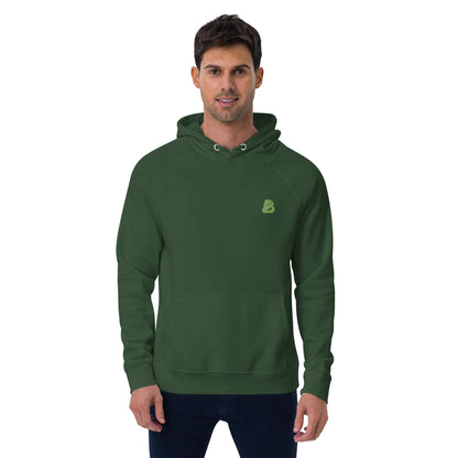 Man wearing Unisex Bio-Raglan-Hoodie N°0 in dark green standing against a white background.