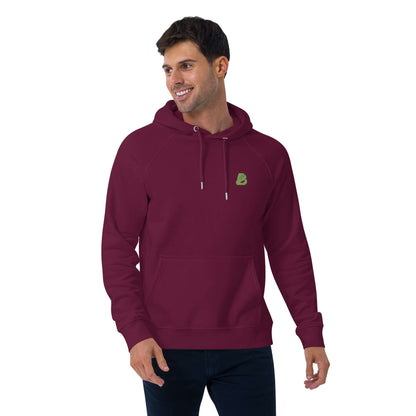 Model wearing Unisex Bio-Raglan-Hoodie N°0 in maroon showing casual fit and comfort, styled with jeans and eco-friendly design.