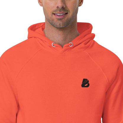 Model wearing the Unisex Bio-Raglan-Hoodie N°1 in vibrant orange showcasing comfort and style with a subtle logo on the chest.