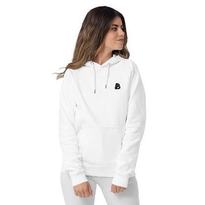 Woman wearing Unisex Bio-Raglan-Hoodie N°1, showcasing stylish and comfortable white hoodie with logo on chest.