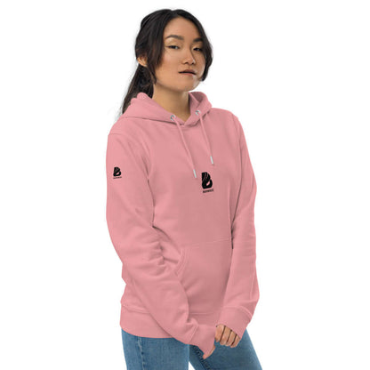 Woman wearing Umweltfreundlicher Unisex-Kapuzenpullover N°0, a pink eco-friendly hoodie made from organic and recycled materials.