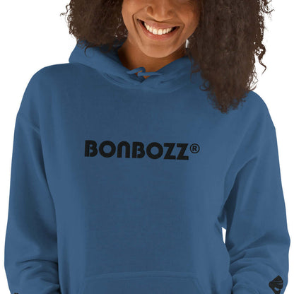 Woman wearing blue Unisex-Kapuzenpullover N°46 with 'Bonbozz' logo, showcasing soft and stylish hoodie for cool evenings.