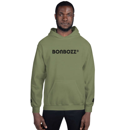Man wearing Unisex-Kapuzenpullover N°46, olive green hoodie with Bonbozz logo, perfect for stylish and cozy evenings. 50% cotton, 50% polyester.
