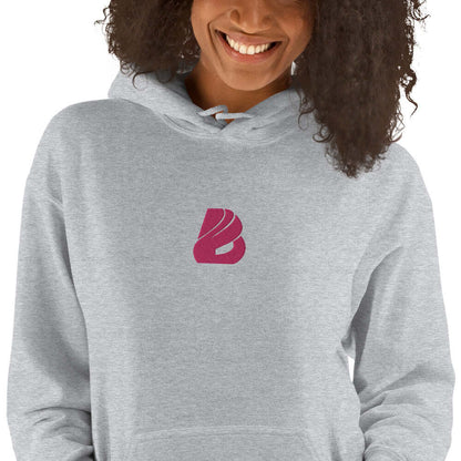 Person wearing Unisex-Kapuzenpullover N°44 with a stylish logo design, perfect for cozy evenings, half cotton and half polyester.