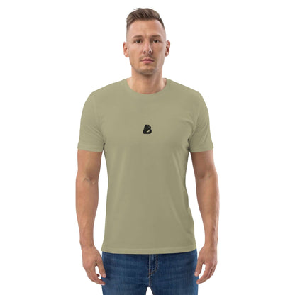 Person wearing Unisex-Bio-Baumwoll-T-Shirt N°0 in sage green, made from 100% organic cotton, showcasing eco-friendly fashion.